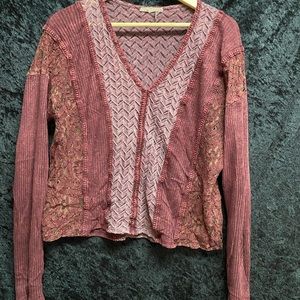 Deep red long sleeve top.